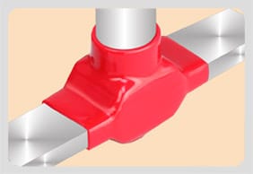 A red moulded shroud sealed around a round stem entering a joint between two flat busbars
